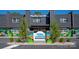 Attractive building exterior with unique architectural elements, colorful murals, and professional landscaping at 2000 Patio Ct # 129, Charlotte, NC 28205