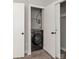 Interior laundry room with a washer and wire shelving at 2000 Patio Ct # 129, Charlotte, NC 28205
