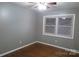 Bedroom with hardwood floors, gray walls and window at 2044 Helen Dr, Gastonia, NC 28054