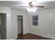This cozy bedroom has a ceiling fan, wood-look floors, window and closet at 2044 Helen Dr, Gastonia, NC 28054