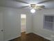 Bright bedroom with hardwood floors, window with blinds, and ceiling fan at 2044 Helen Dr, Gastonia, NC 28054