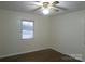 Simple bedroom with hardwood floors and a window at 2044 Helen Dr, Gastonia, NC 28054