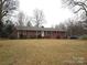 Charming one-story brick home with a well-manicured lawn and inviting front entrance, perfect for curb appeal at 2044 Helen Dr, Gastonia, NC 28054