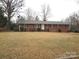 Ranch style brick home with a well-maintained lawn at 2044 Helen Dr, Gastonia, NC 28054