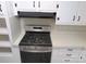 Modern kitchen featuring a stainless steel gas range with a built-in overhead vent hood, complete with ample countertop space at 2044 Helen Dr, Gastonia, NC 28054
