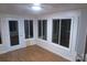Bright sunroom features wood floors, multiple windows, and a glass door at 2044 Helen Dr, Gastonia, NC 28054