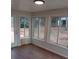 Sunroom with multiple windows and vinyl flooring at 2044 Helen Dr, Gastonia, NC 28054