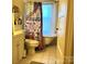 Bathroom with clawfoot tub, shower, and patterned shower curtain at 217 Brent St, Wadesboro, NC 28170