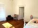 Spacious bedroom with hardwood floors and built-in shelving at 217 Brent St, Wadesboro, NC 28170