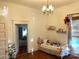 Hardwood floors, built-in shelving, and doorway to another room at 217 Brent St, Wadesboro, NC 28170