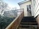 Wooden deck and stairs leading to backyard at 217 Brent St, Wadesboro, NC 28170