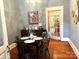 Dining room with hardwood floors, black table, and four chairs at 217 Brent St, Wadesboro, NC 28170