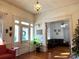 Bright entryway with hardwood floors, and view into living room at 217 Brent St, Wadesboro, NC 28170