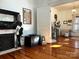 Living room with hardwood floors, fireplace, and antique trunk at 217 Brent St, Wadesboro, NC 28170