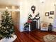 Living room with hardwood floors, Christmas tree, and fireplace at 217 Brent St, Wadesboro, NC 28170