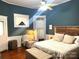 Main bedroom with hardwood floors, a ceiling fan and en-suite bathroom at 217 Brent St, Wadesboro, NC 28170