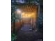 Secluded patio area with string lights and seating at 217 Brent St, Wadesboro, NC 28170