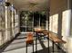 Relaxing screened porch with table and benches, perfect for outdoor dining at 217 Brent St, Wadesboro, NC 28170