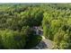 Spacious home surrounded by lush trees, offering a tranquil setting at 227 Wildwood Cove Dr, Mooresville, NC 28117