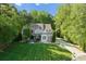 Luxury home with manicured lawn and tree-lined property at 227 Wildwood Cove Dr, Mooresville, NC 28117