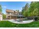 Luxury home with a private pool, waterfall, and spacious patio at 227 Wildwood Cove Dr, Mooresville, NC 28117