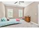 Charming bedroom with a comfortable bed and natural light at 227 Wildwood Cove Dr, Mooresville, NC 28117