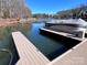 Private boat slip with a covered pontoon boat at 227 Wildwood Cove Dr, Mooresville, NC 28117