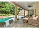 Enjoy the covered patio with pool views at 227 Wildwood Cove Dr, Mooresville, NC 28117