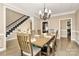 Formal dining room with chandelier and hardwood floors at 227 Wildwood Cove Dr, Mooresville, NC 28117