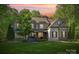 Two-story house with stone accents and landscaped lawn at 227 Wildwood Cove Dr, Mooresville, NC 28117