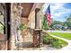Stone porch with rocking chairs and American flag at 227 Wildwood Cove Dr, Mooresville, NC 28117