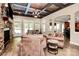 Spacious Gathering room with stone fireplace and access to patio at 227 Wildwood Cove Dr, Mooresville, NC 28117