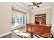 Spacious home office with built-in cabinetry and large windows at 227 Wildwood Cove Dr, Mooresville, NC 28117