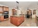 Kitchen island and breakfast nook with hardwood floors at 227 Wildwood Cove Dr, Mooresville, NC 28117