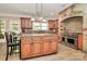 Island kitchen with granite countertops and stainless steel appliances at 227 Wildwood Cove Dr, Mooresville, NC 28117