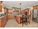 Gourmet kitchen features granite countertops, custom cabinetry, and island at 227 Wildwood Cove Dr, Mooresville, NC 28117