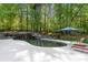 Inviting pool area with lounge chairs and umbrella at 227 Wildwood Cove Dr, Mooresville, NC 28117