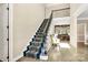 Elegant staircase with ornate railing and runner at 227 Wildwood Cove Dr, Mooresville, NC 28117