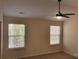 Main bedroom with ceiling fan and two windows at 3170 S Legacy Park Blvd, Fort Mill, SC 29707