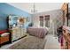 Light and airy bedroom with a dresser and full-length mirror at 3406 Red Fox Trl, Weddington, NC 28104