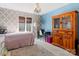 Charming bedroom with unique wall decor and built-in shelving at 3406 Red Fox Trl, Weddington, NC 28104