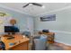 Spacious home office with a desk, comfortable chairs, and ample natural light at 3406 Red Fox Trl, Weddington, NC 28104