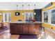 Spacious kitchen island with granite countertops and ample cabinetry at 3406 Red Fox Trl, Weddington, NC 28104