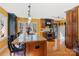 Modern kitchen with island, granite countertops, and stainless steel appliances at 3406 Red Fox Trl, Weddington, NC 28104