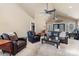 Relaxing living room with vaulted ceiling, leather furniture, and access to backyard at 3406 Red Fox Trl, Weddington, NC 28104
