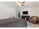 Large main bedroom with sliding barn door to the closet and a wall-mounted TV at 3406 Red Fox Trl, Weddington, NC 28104