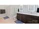 Clean bathroom with double vanity and shower at 3630 N Davidson St # 4413, Charlotte, NC 28205