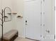 Stylish entryway with bench and coat rack at 3630 N Davidson St # 4413, Charlotte, NC 28205