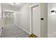 Clean and bright hallway with modern flooring and doors at 3630 N Davidson St # 4413, Charlotte, NC 28205