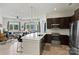 Modern kitchen with island and stainless steel appliances at 3630 N Davidson St # 4413, Charlotte, NC 28205